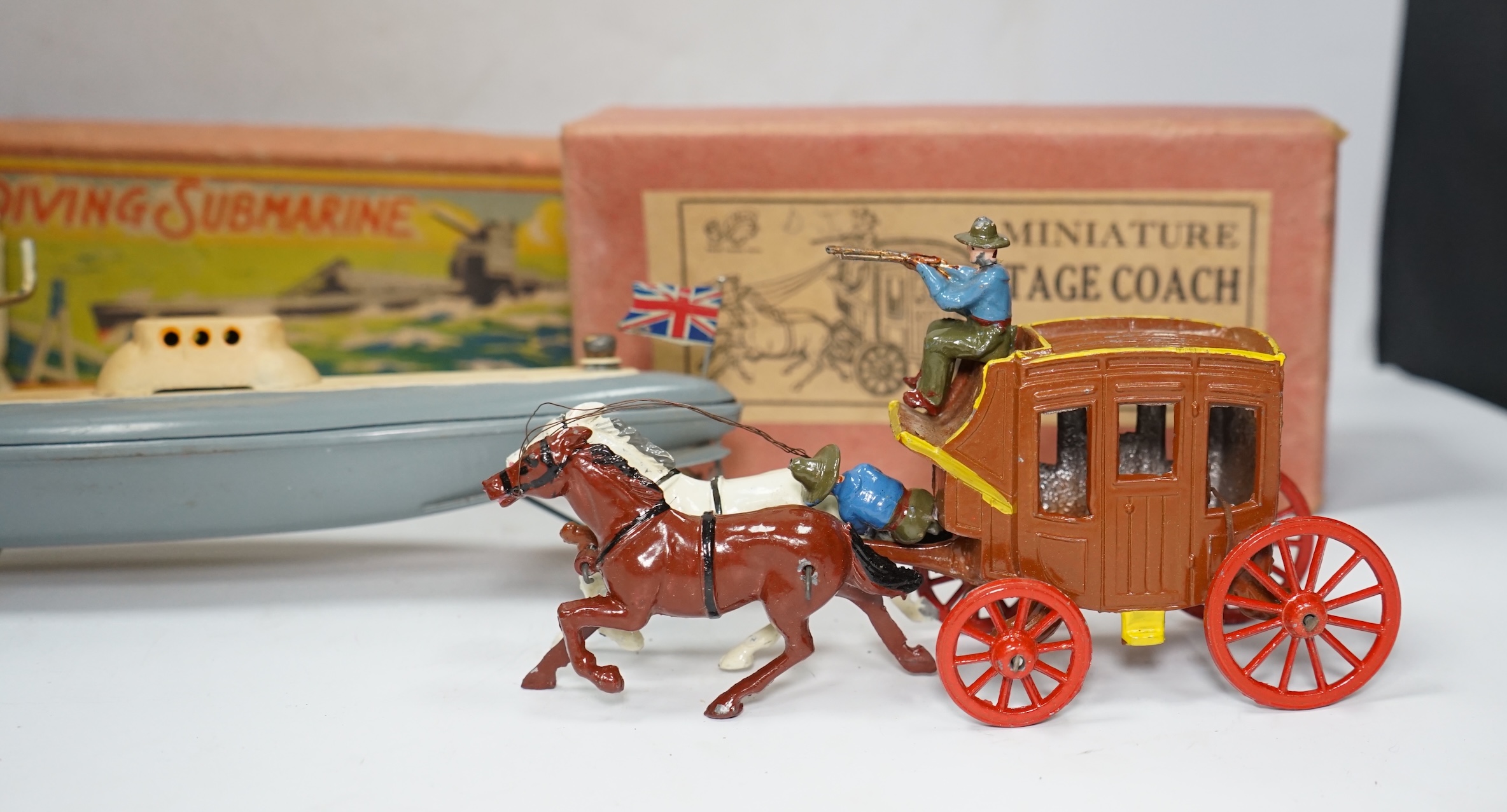 Three boxed 1930s toys; a Johillco Miniature Stage Coach, a Charbens (Set; 503) The Farm Wagon, and a CK, Japan, Diving Submarine in grey-blue finish with Union flag and friction drive motor. Condition - fair to good.